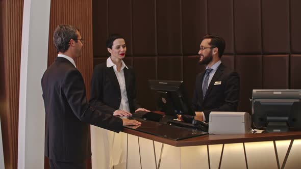 Business People Checking In the Hotel