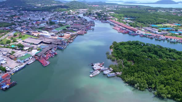 Aerial view Drone Camera of boats in Koh Sirey fishing port Phuket Thailand