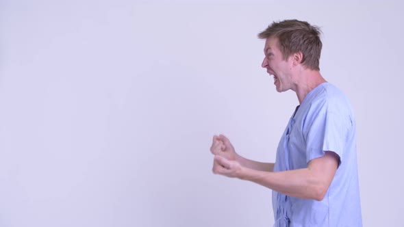 Portrait of Stressed Young Man Patient Looking Angry and Talking