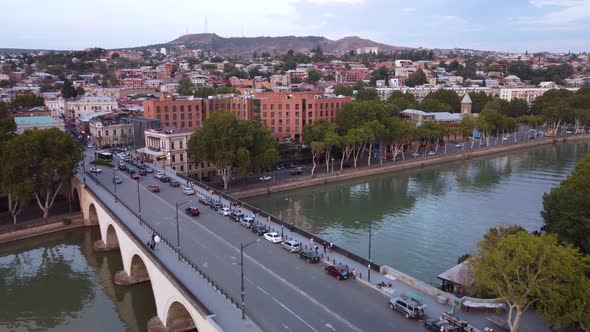 Traffic On The Bridge And Evening City Aerial