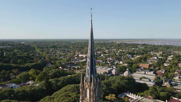 Aerial of San Isidro cathedral revealing neighborhood and La Plata river