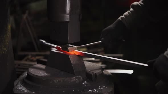 Blacksmith Works with a Hot Metal