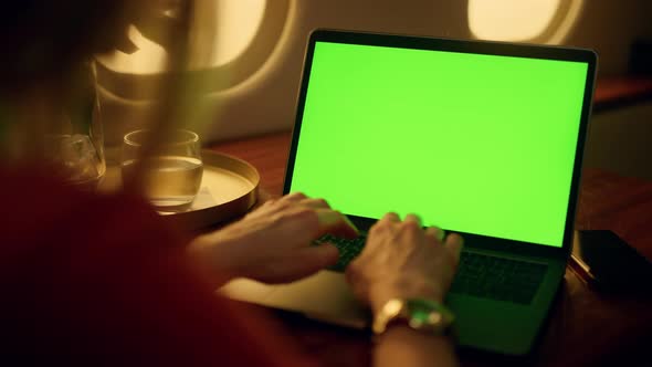 Hands Typing Green Laptop Closeup