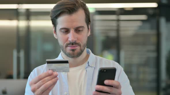 Man Doing Online Payment on Smartphone