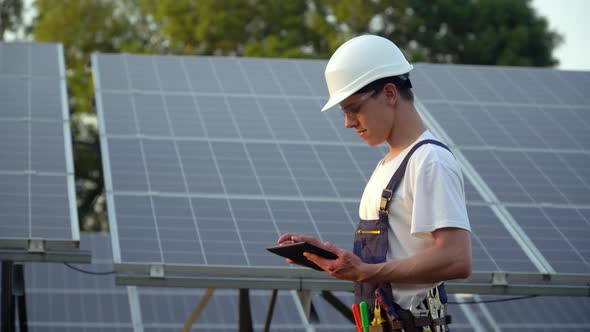 Solar Panel Technician Working with Solar Panels