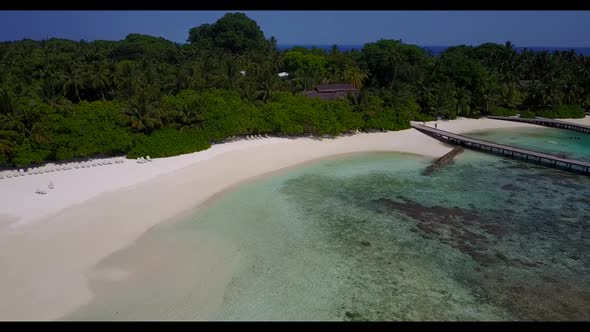 Aerial above landscape of tropical lagoon beach vacation by shallow sea with white sandy background 