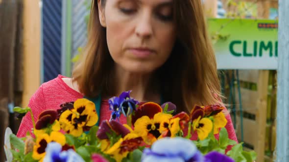 Female florist checking flowers