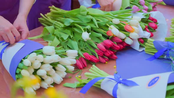 A Woman Collects a Bouquet of Tulips in Flower Market. Flower Delivery, Order Creation, Small