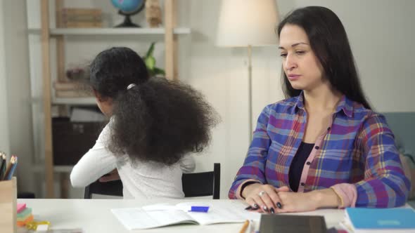 Medium Shot of Creative Mother Helping Her Daughter Working Together