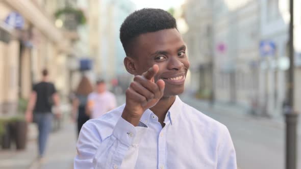 Outdoor African Man Pointing at the Camera