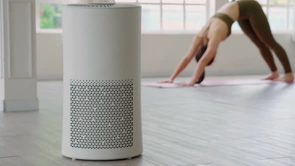 Air purifier in cozy white Living room for filter and cleaning removing dust PM2.5 HEPA at home