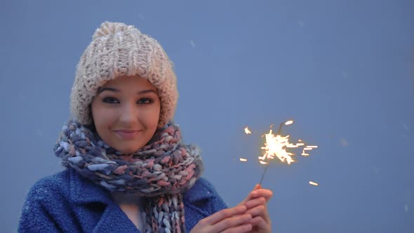 Winter Young Woman Portrait with Burning Firelight .