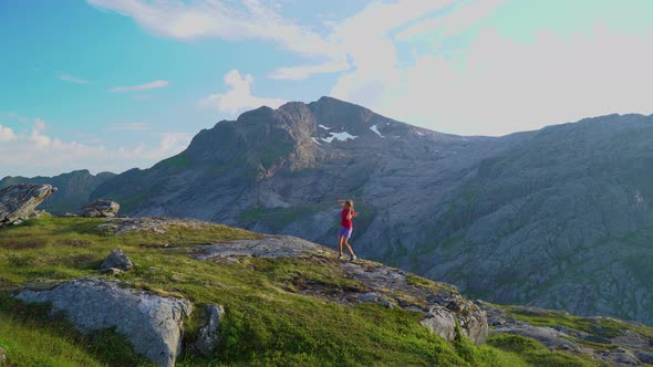 The Girl Jumps and Rejoices in the Mountains