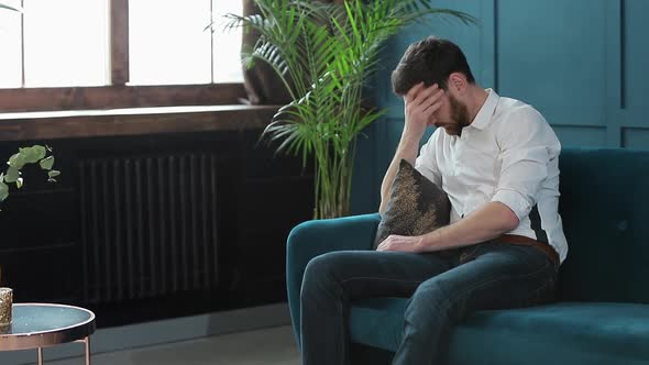 Man Client Sitting with Female Psychologist on the Comfortable Couch During the Psychological