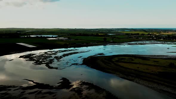 Irish landscape and water reflections at sunset.