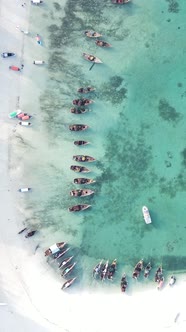 Vertical Video Boats in the Ocean Near the Coast of Zanzibar Tanzania