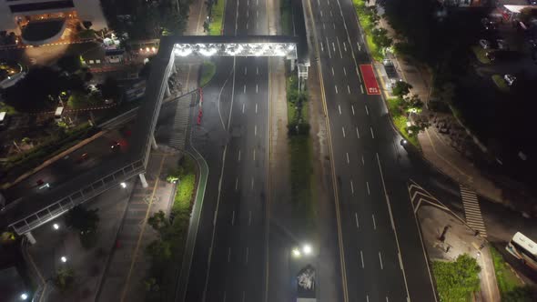 Aerial Tilt Down Into Overhead Shot of Empty Multi Lane Motorway During Coronavirus Epidemic 