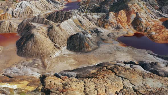 Aerial View of a Landscape Similar To the Planet Mars with Red Hills and Rivers with Red Water