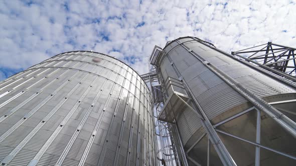 Grain elevator for storage of agricultural crops. Modern silos. Close-up.