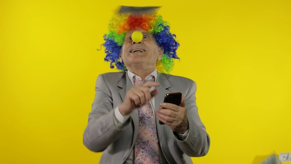Clown Businessman Freelancer Boss Receives Money Income While Using Smartphone