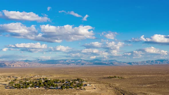 Aerial Hyperlapse flying by California City in Mojave Desert on cloudy day