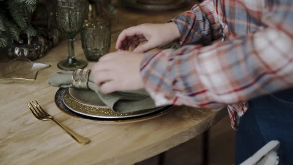 Hands Serve Festive Wooden Table Puts Textile Napkin Decorates Golden Ring