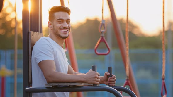 Portrait Attractive Millennial Middle Eastern Arab Athletic Guy Doing Exercise Outdoor at Sports