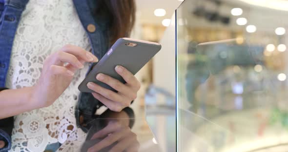 Using smart phone in shopping mall