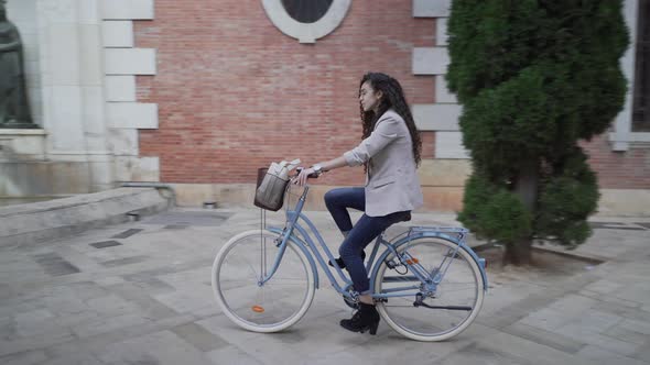 Moroccan Female Wearing Casual Is Riding A Bicycle At Daytime