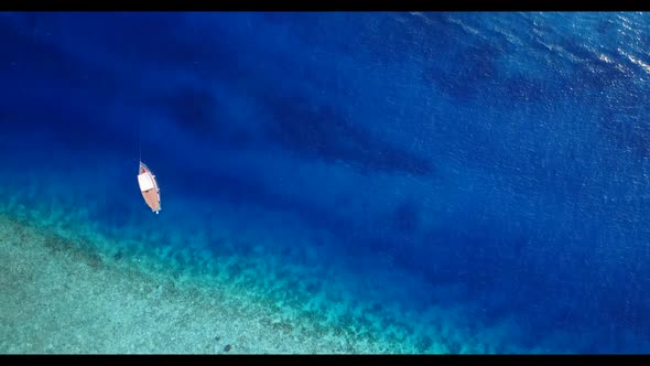 Aerial top down seascape of relaxing shore beach trip by blue ocean and white sand background of a d