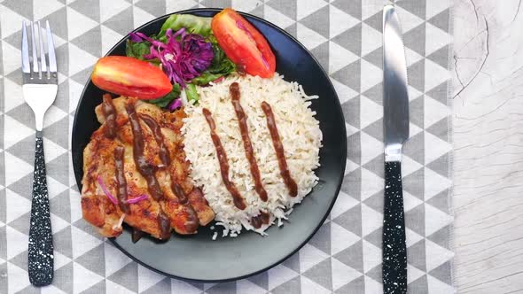 Grill Chicken  Rice and Salad on Plate on Table