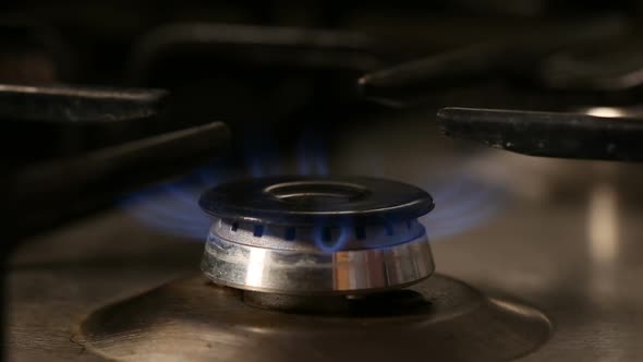 Hand lighting one gas burner