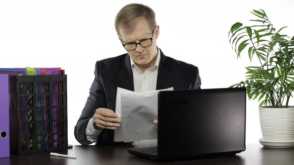 Businessman Working in Office. Negative Amazed of Reading Paper Full of Mistakes