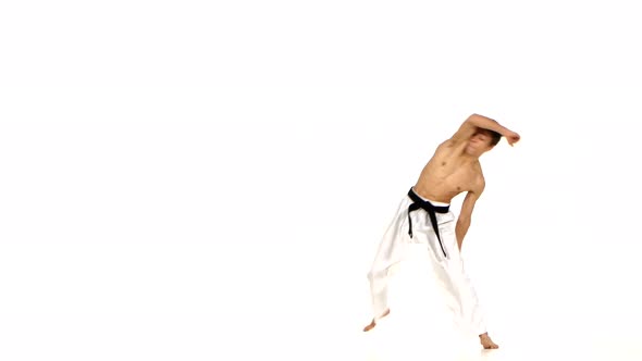 Karate or Taekwondo Makes a Somersault Through Itself