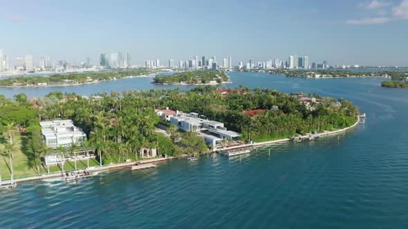  Aerial Slow Motion of Tropical Nature Island. Star Island Miami on Background alt