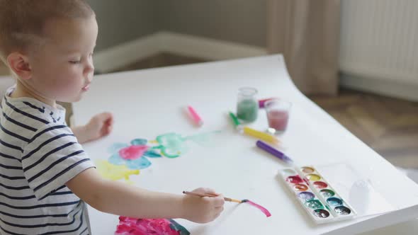 Passionate Caucasian Baby Kid Boy Preschooler Age Painting Sitting Home Indoors