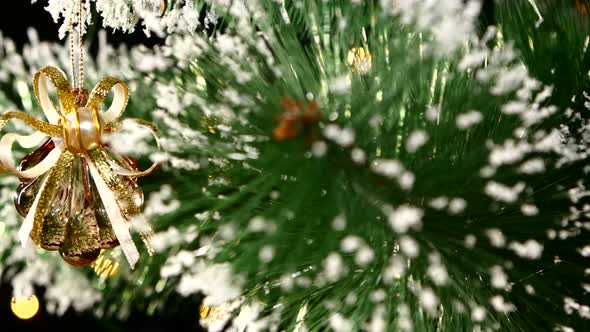 Unusual Christmas Decoration Like Shell - a Crystalline Brown Toy on Tree, Bokeh, Light, Black