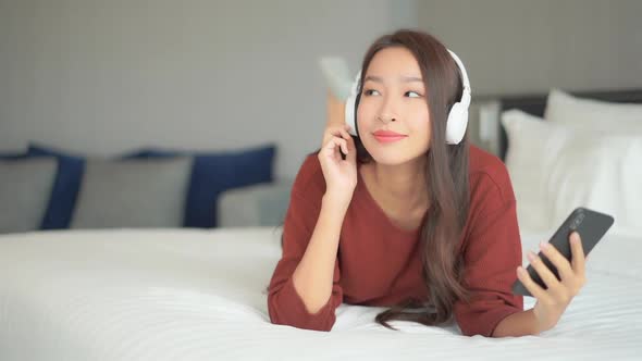 Woman use smart phone for listen music