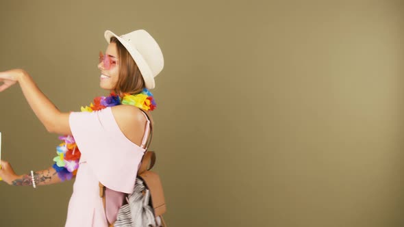 Young Lady in Sunglasses Hat Hawaiian Lei and Backpack