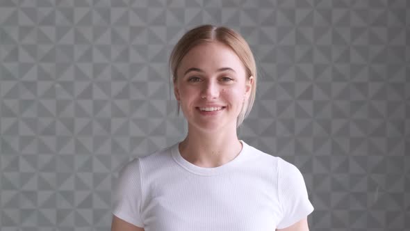 Portrait of beautiful young woman with with amazing eyes and attractive smile.