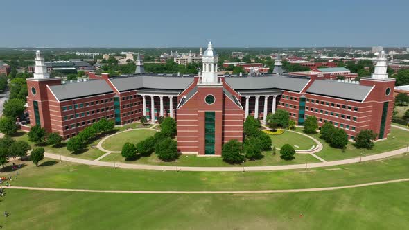 Rising aerial reveal of college building at Baylor University in Waco Texas.