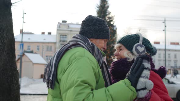 Happy Elderly Couple Grandmother Grandfather Tourists Traveling in European City Near Christmas Tree