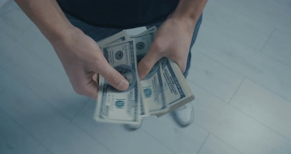 Closeup Man Counting Dollars