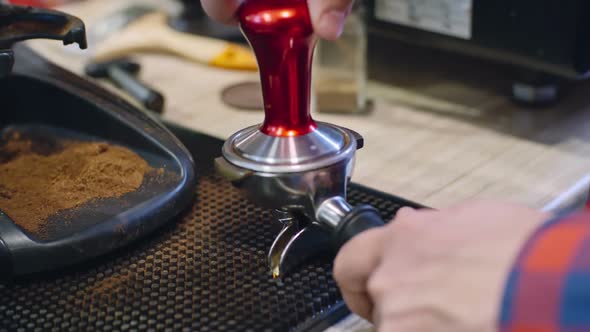 Pressing Freshly Ground Coffee