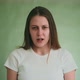 Sad Angry Lady Holds Back Tears Looking Into Camera on Green - VideoHive Item for Sale
