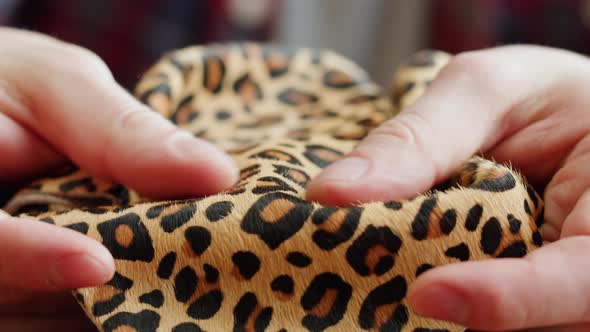 Craftsman Touching Leopard Leather Closeup Production of Handmade Accessories Made of Genuine or