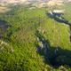 Aerial view of karst landscape, with valleys and cliffs, at sunset - VideoHive Item for Sale