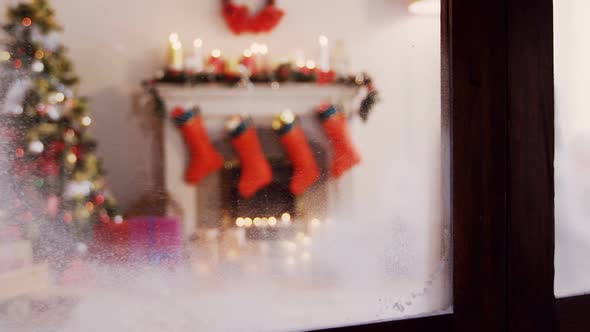 View of christmas tree and decoration from window