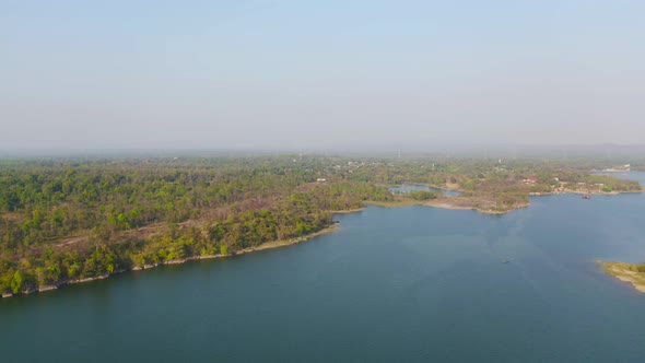 Aerial view of Mekong River with green mountain hill and forest trees. Nature landscape background