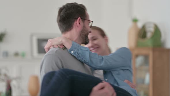 Close Up of Man Swirling While Lifting Woman in Arms